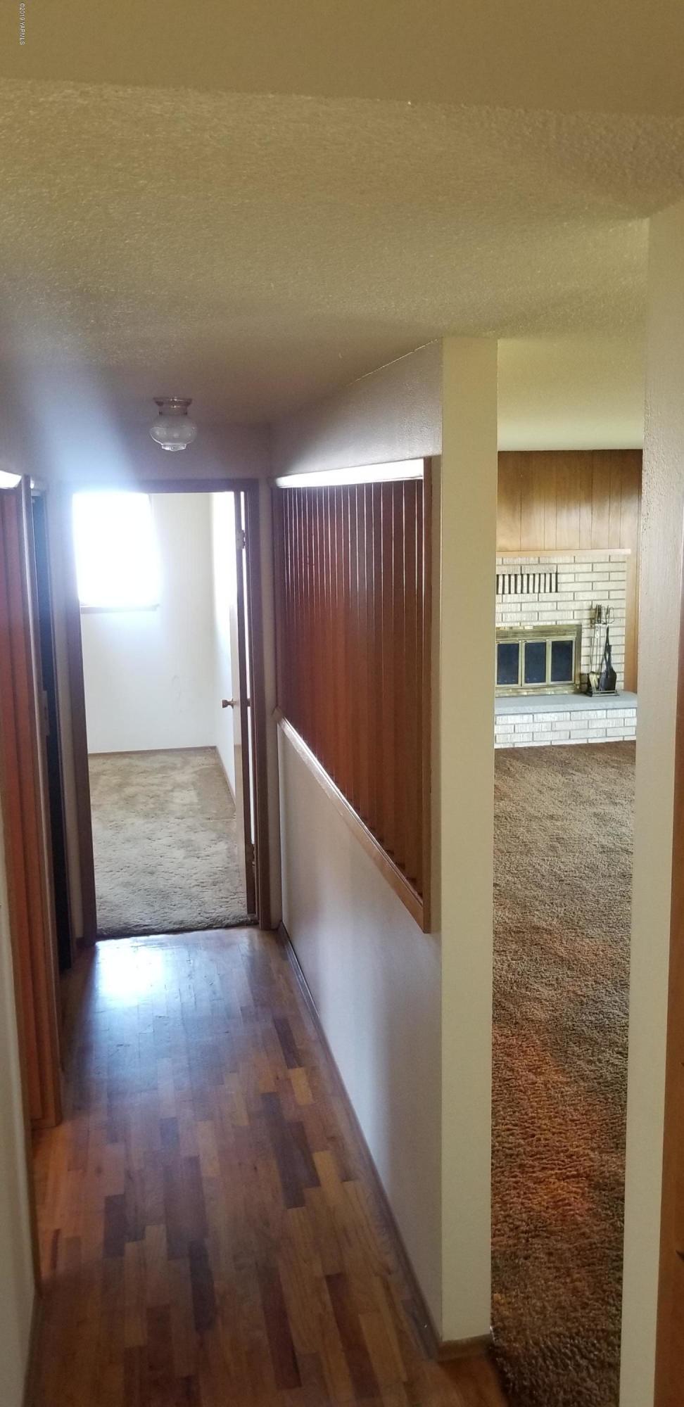 708 Meadowbrook Road Yakima, WA 98903 - Photo 24 of 65 a view of a hallway with wooden floor