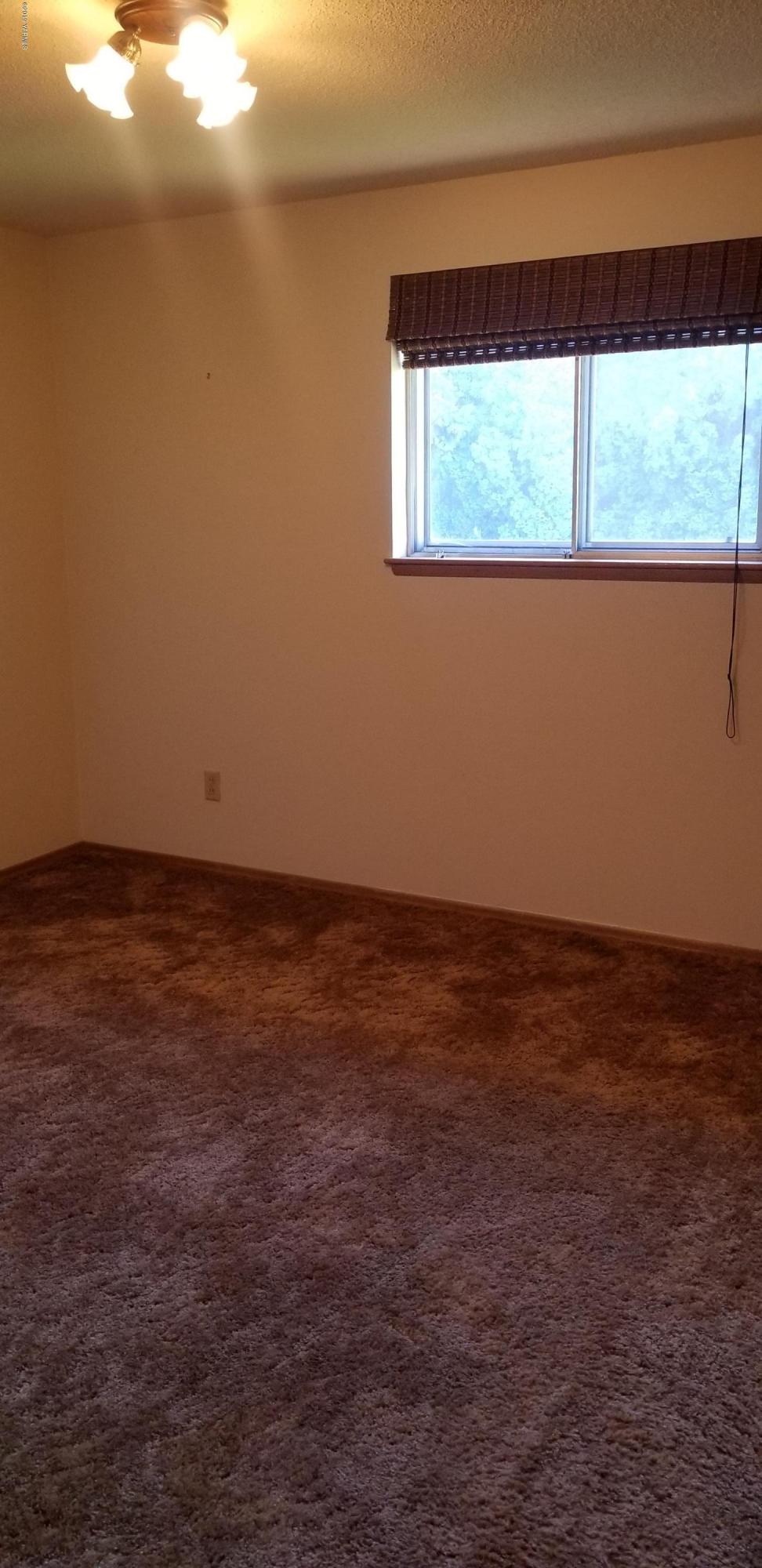 708 Meadowbrook Road Yakima, WA 98903 - Photo 27 of 65 a view of an empty room with a window