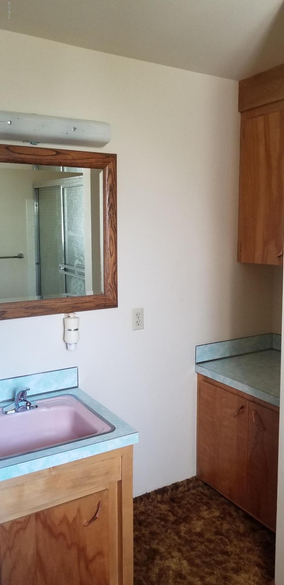 708 Meadowbrook Road Yakima, WA 98903 - Photo 29 of 65 a room with a sink and a mirror