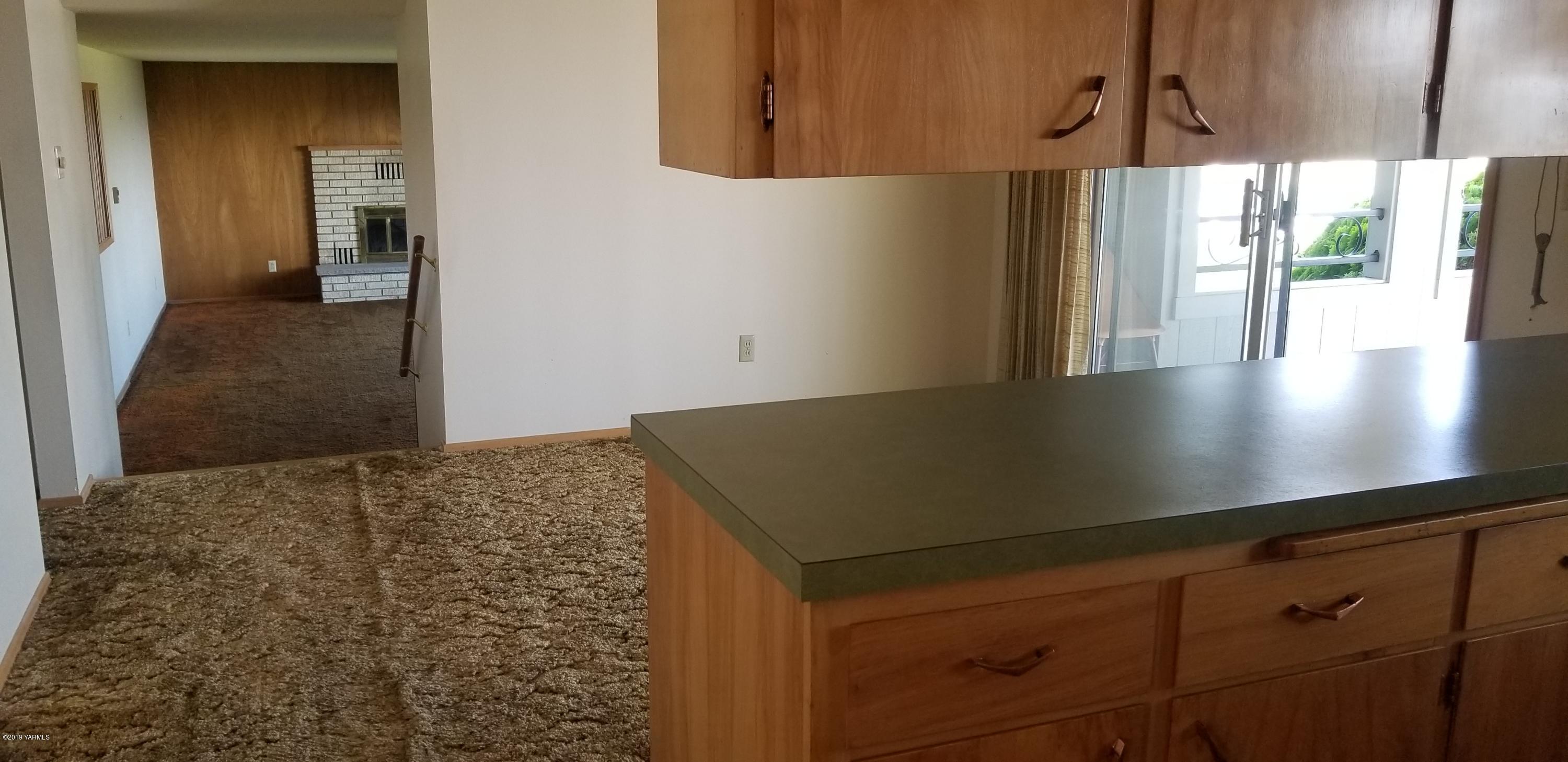 708 Meadowbrook Road Yakima, WA 98903 - Photo 34 of 65 a view of a kitchen with a sink and cabinets