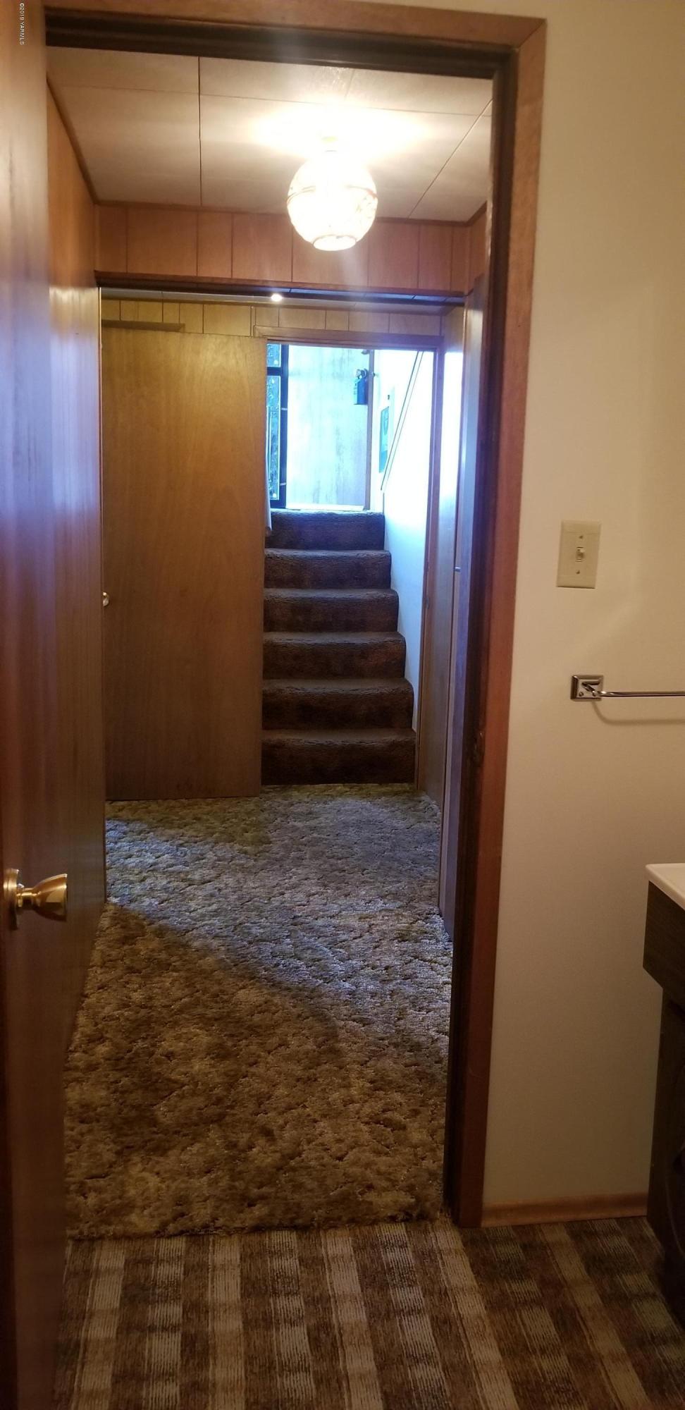 708 Meadowbrook Road Yakima, WA 98903 - Photo 41 of 65 a view of room with stairs and wooden floor