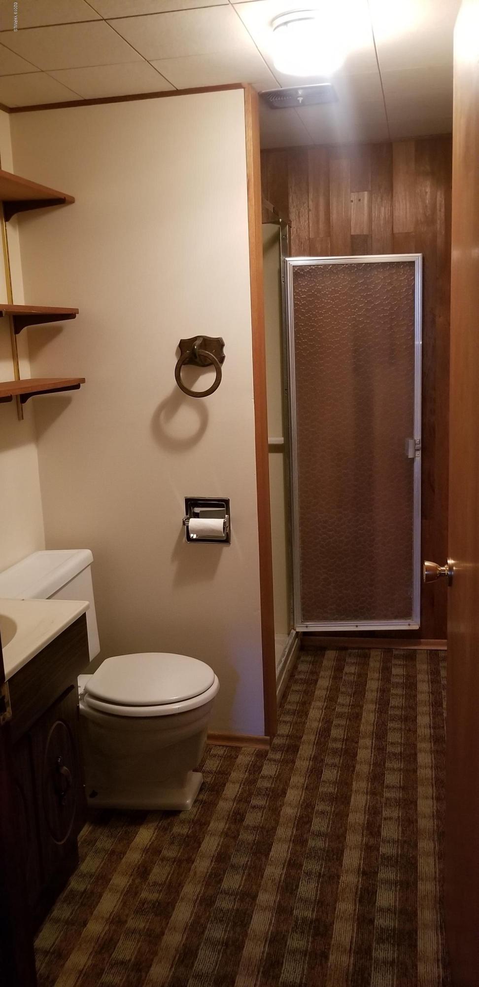 708 Meadowbrook Road Yakima, WA 98903 - Photo 42 of 65 a bathroom with a toilet and a shower