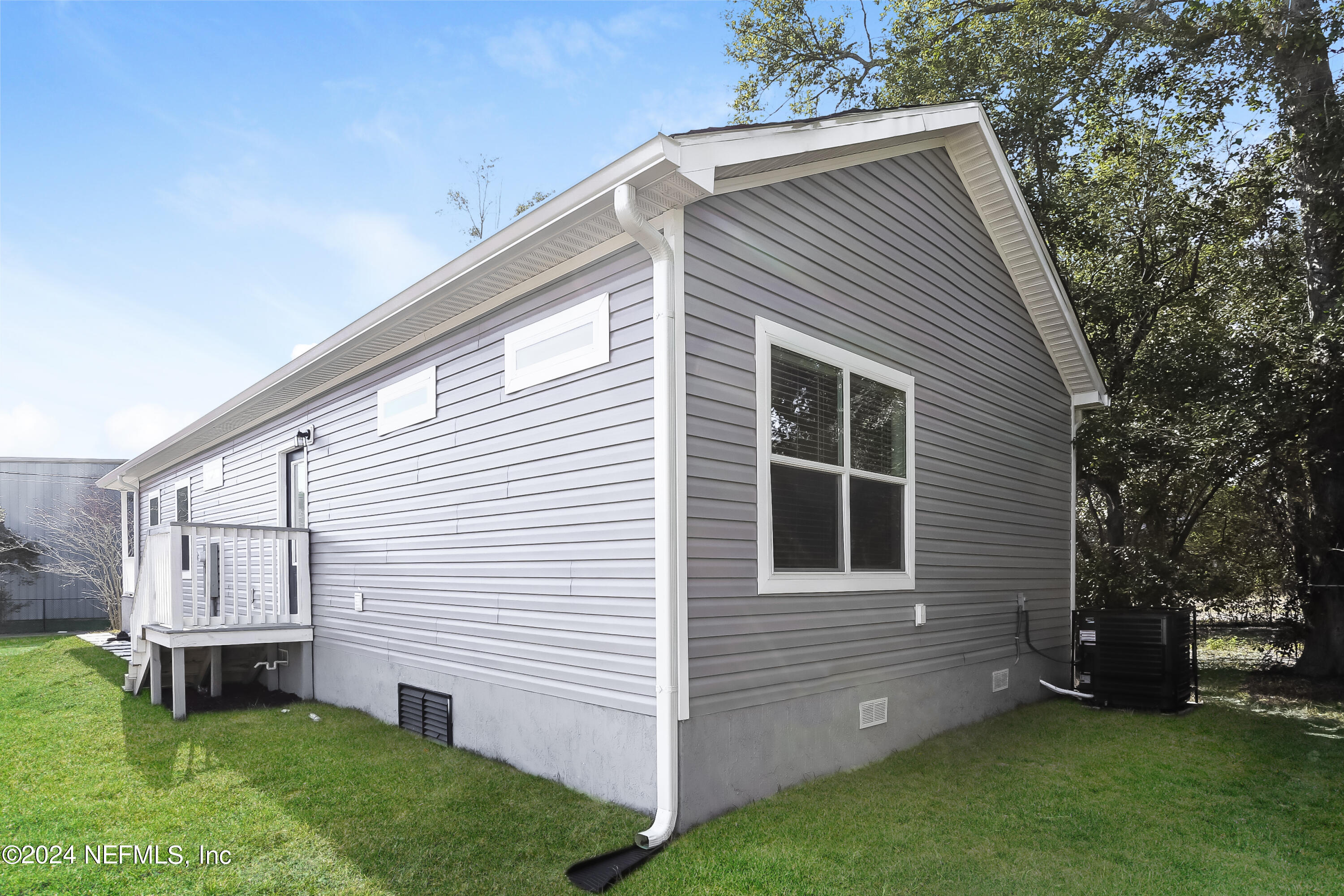 2119 Lewis Street Jacksonville, FL 32204 - Photo 13 of 14 a view of backyard with a garden and deck