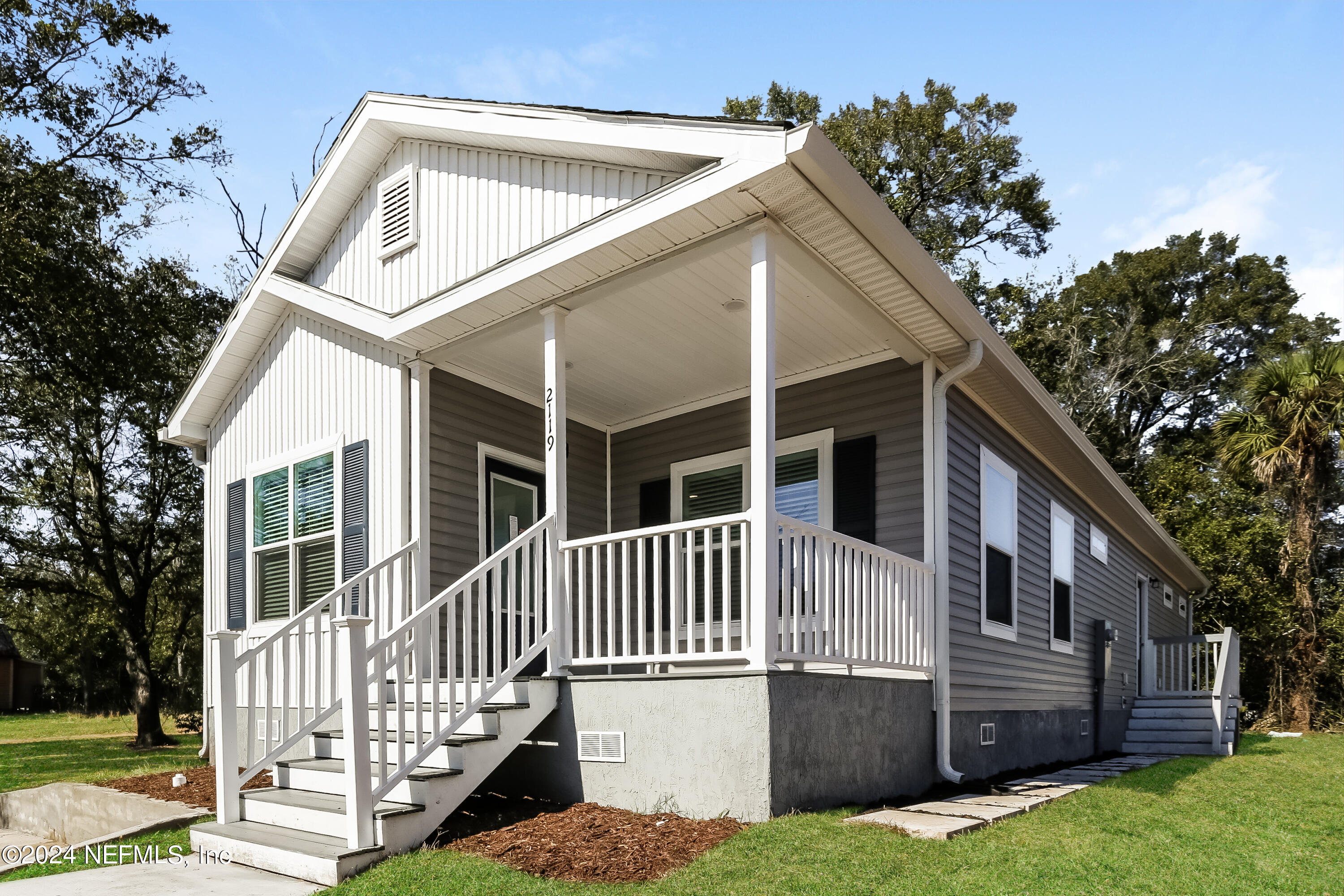 2119 Lewis Street Jacksonville, FL 32204 - Photo 2 of 14 a front view of a house with a yard