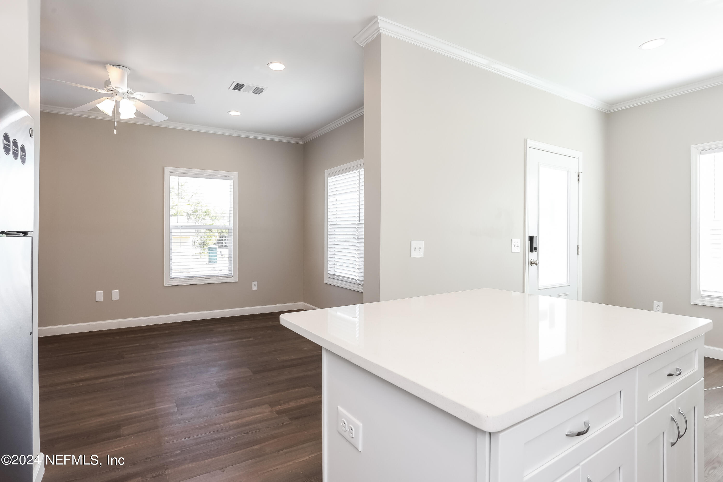2119 Lewis Street Jacksonville, FL 32204 - Photo 6 of 14 a kitchen with a wooden floor and chandelier