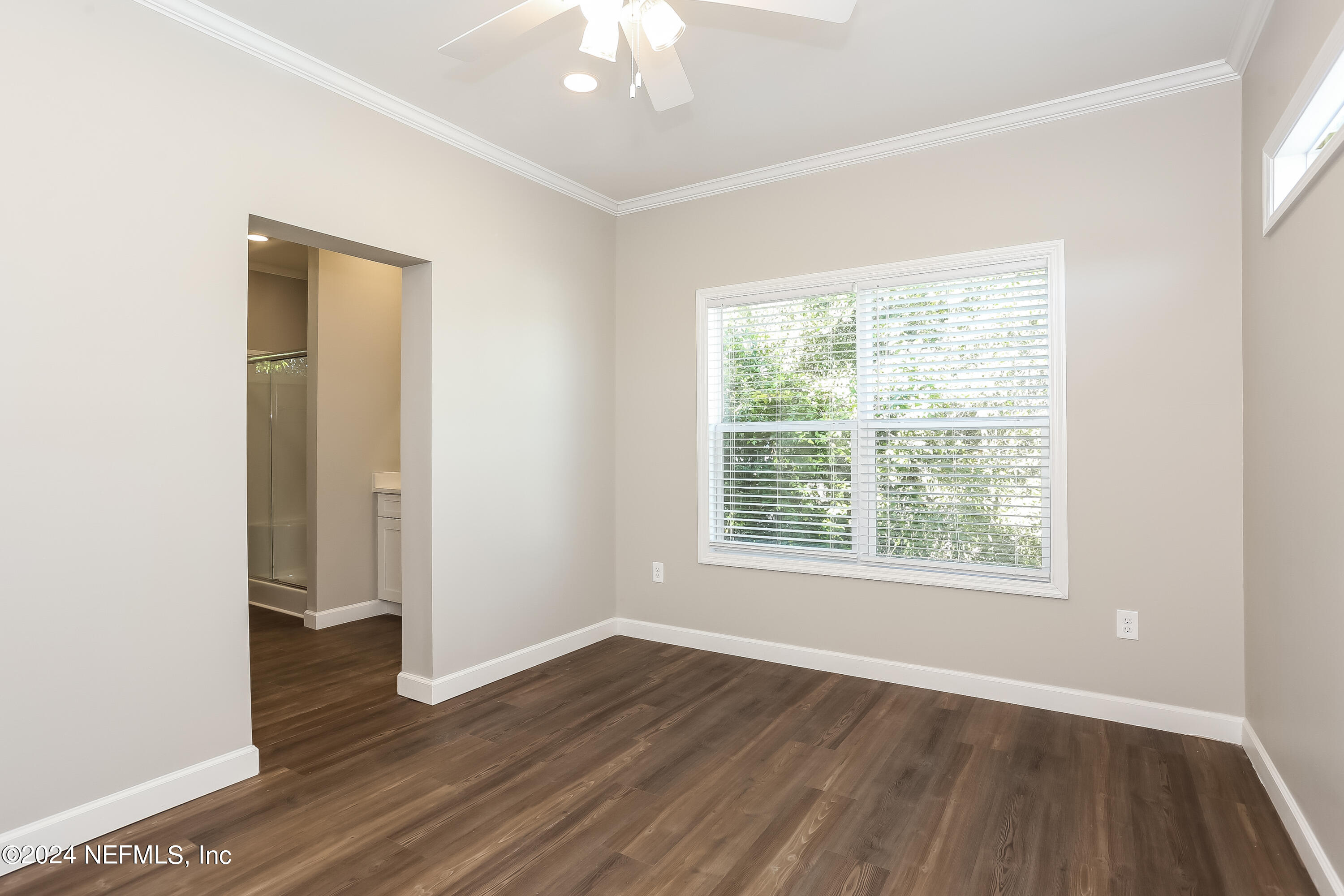 2119 Lewis Street Jacksonville, FL 32204 - Photo 8 of 14 an empty room with wooden floor and windows