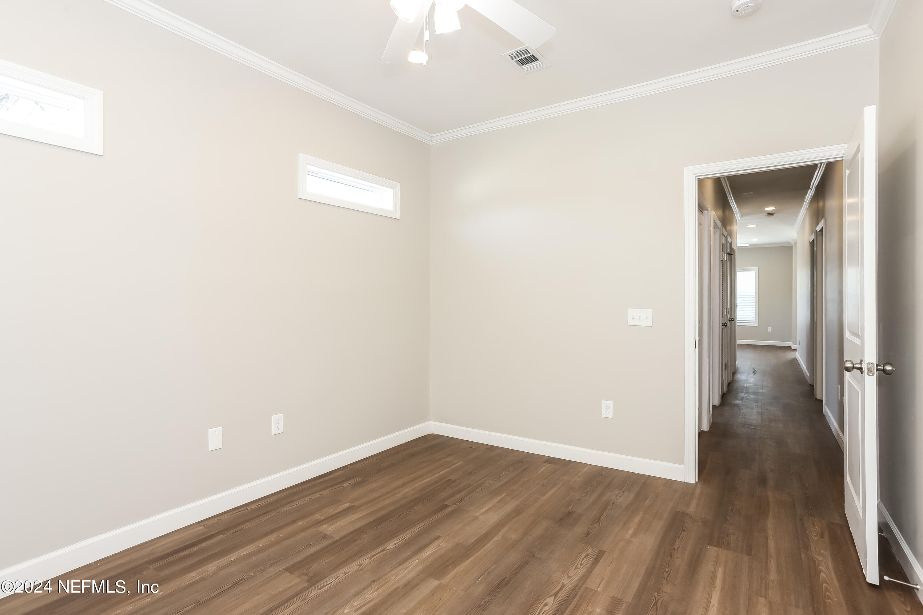 2119 Lewis Street Jacksonville, FL 32204 - Photo 9 of 14 a view of a room with wooden floor and a bathroom