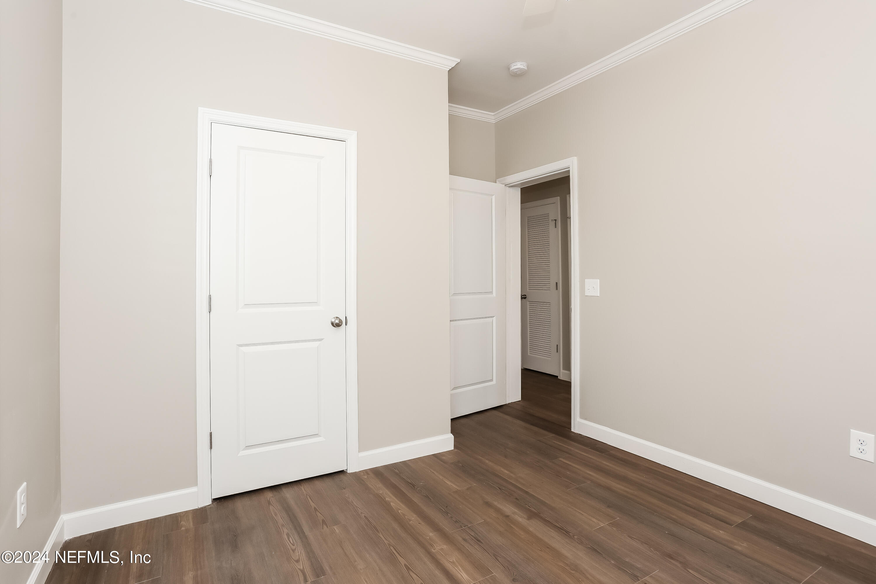 2119 Lewis Street Jacksonville, FL 32204 - Photo 10 of 14 a view of an empty room with wooden floor and closet