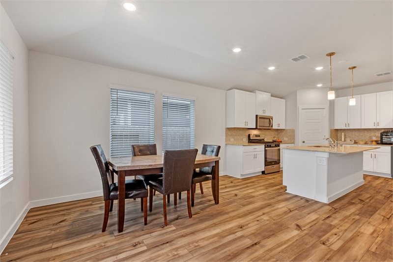 2643 Homestead Rnch Lane Crosby, TX 77532 - Photo 11 of 23 a view of kitchen with cabinets table and chairs