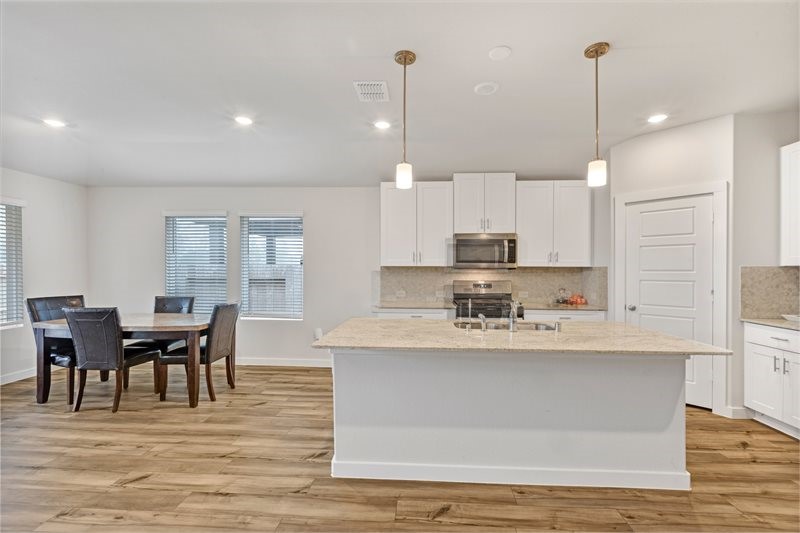 2643 Homestead Rnch Lane Crosby, TX 77532 - Photo 2 of 23 a large kitchen with kitchen island a island in the center