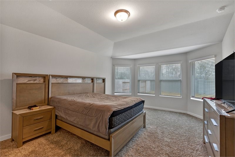 2643 Homestead Rnch Lane Crosby, TX 77532 - Photo 23 of 23 a bed sitting in a bedroom next to a window
