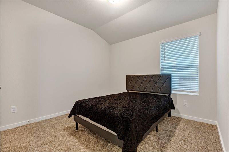 2643 Homestead Rnch Lane Crosby, TX 77532 - Photo 10 of 23 a bedroom with a bed and window