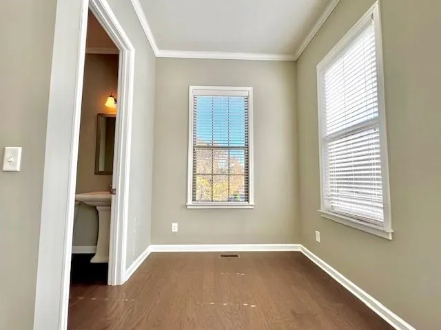 an empty room that has a window in it