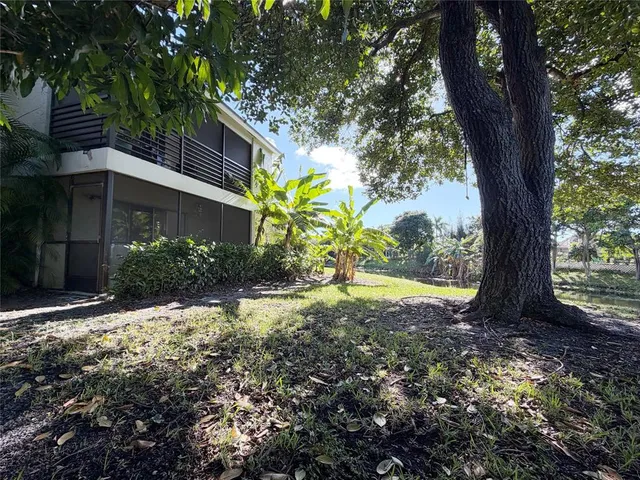 a backyard of a house with lots of green space