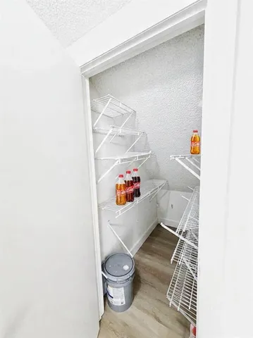 a bathroom with a toilet and a shower curtain