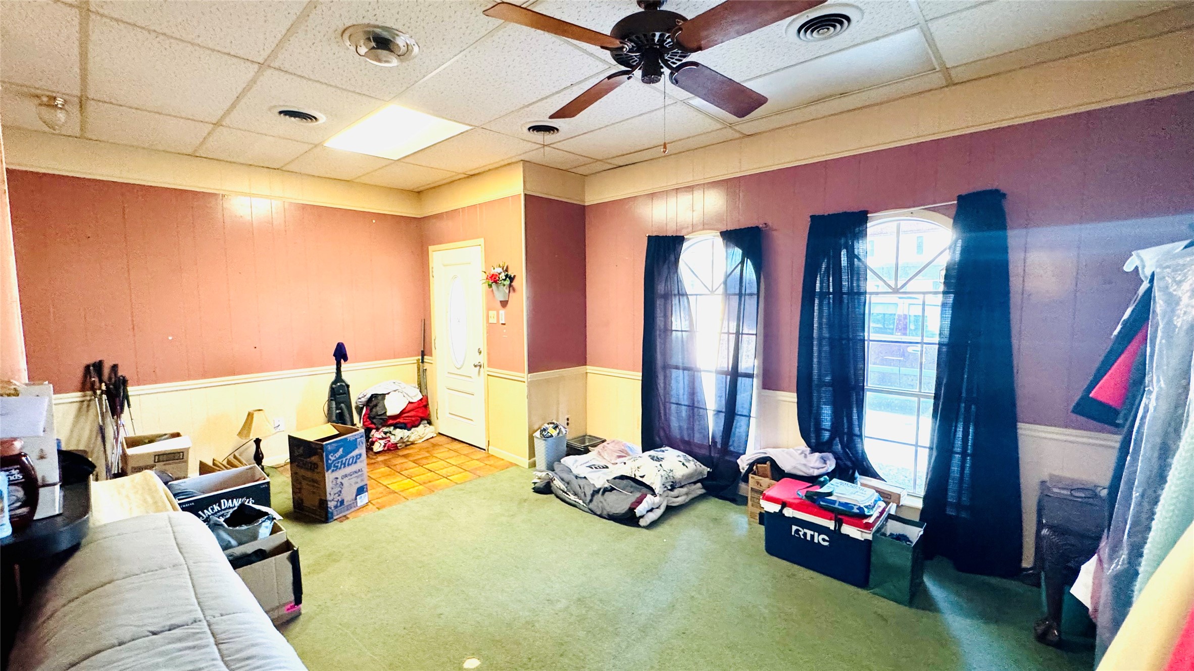 811 North Travis Street Liberty, TX 77575 - Photo 13 of 31 a bedroom with furniture and a large window