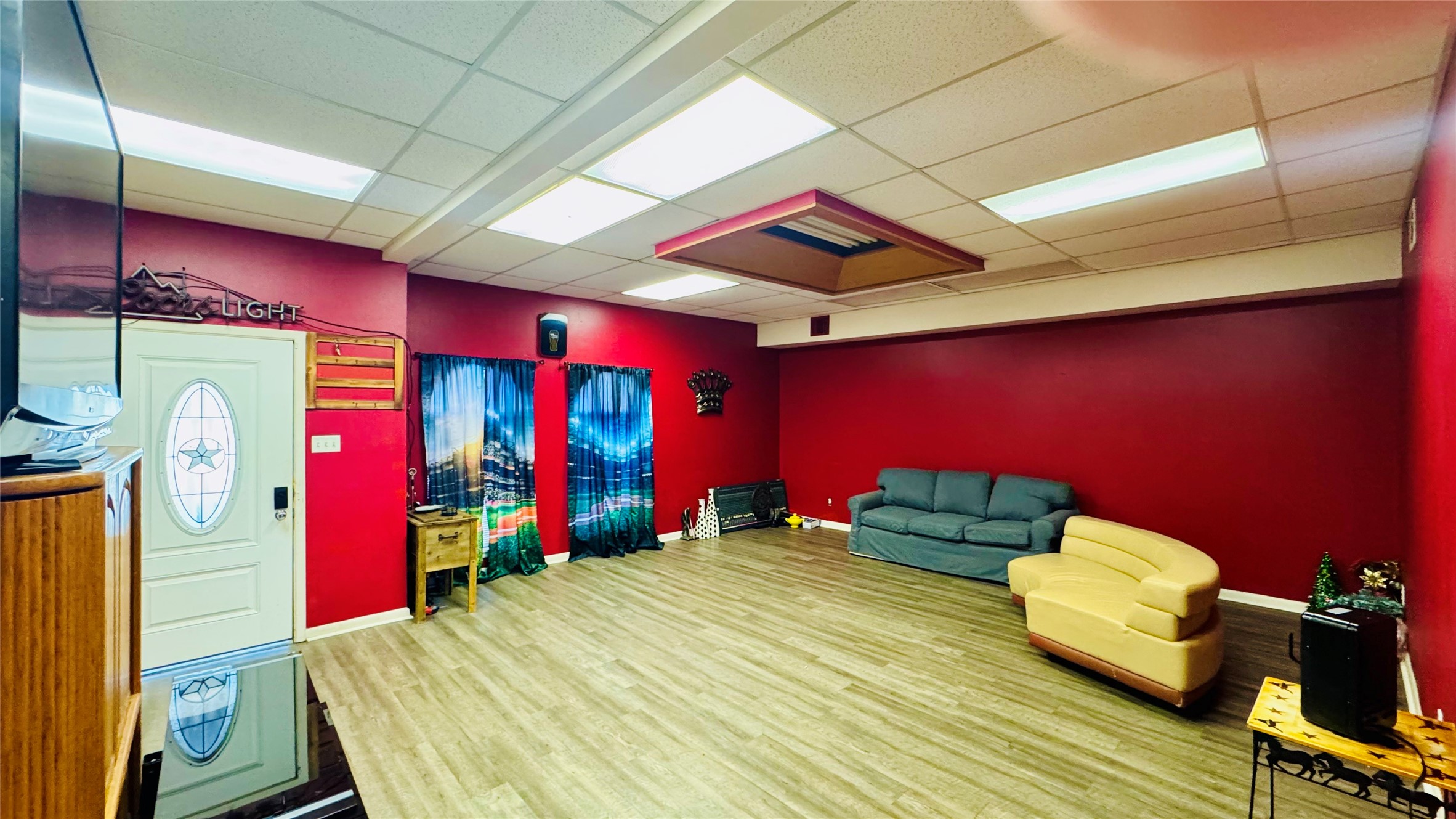 811 North Travis Street Liberty, TX 77575 - Photo 2 of 31 a bedroom with furniture and a large window