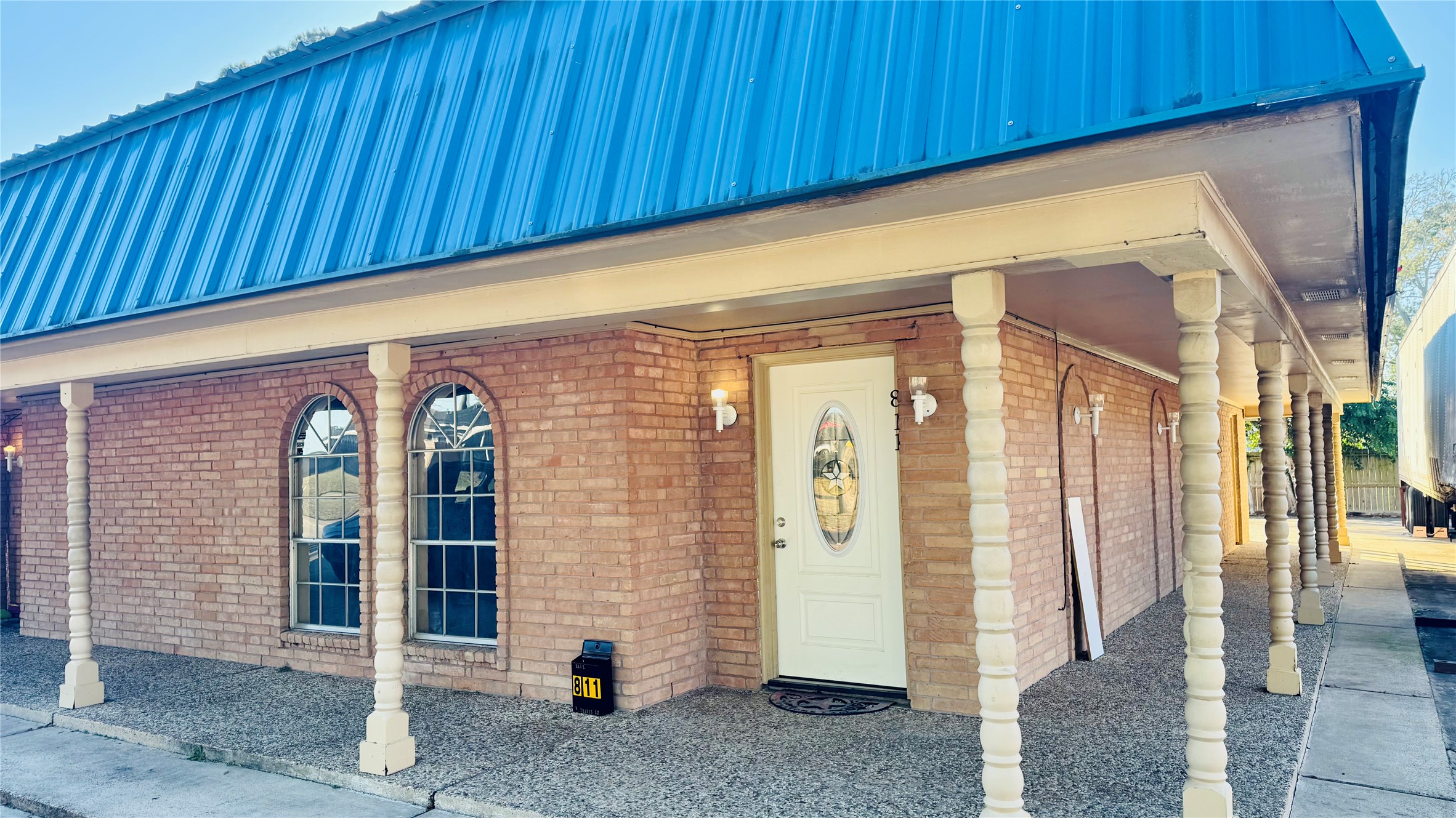 811 North Travis Street Liberty, TX 77575 - Photo 23 of 31 a view of a brick house with an outdoor space