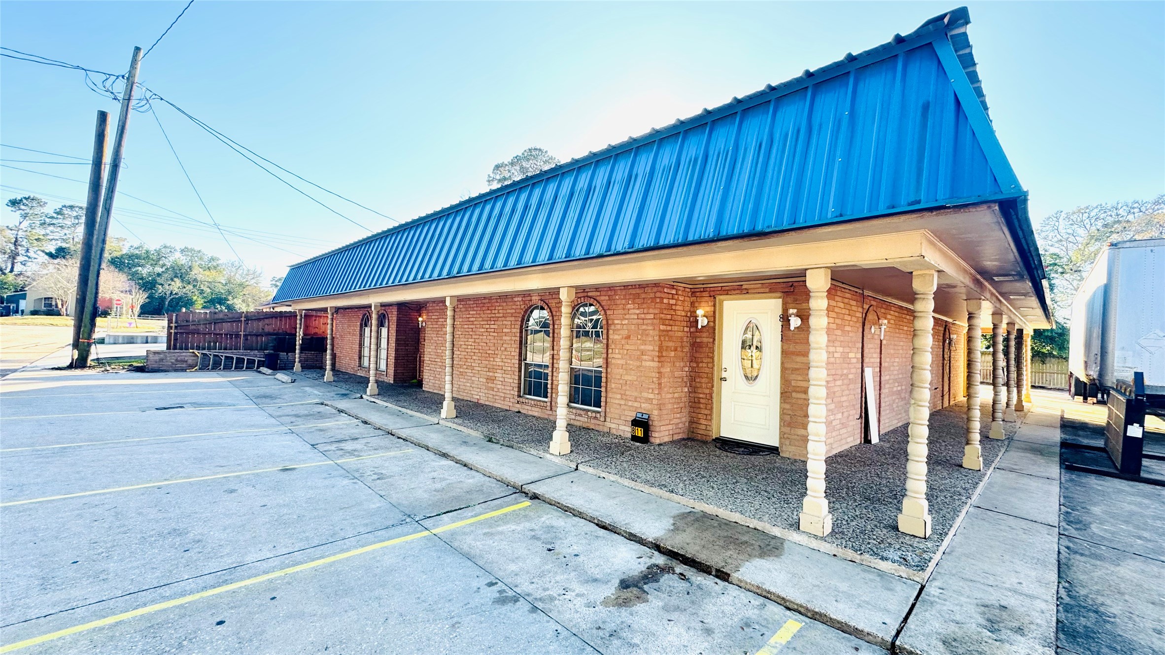 811 North Travis Street Liberty, TX 77575 - Photo 24 of 31 a view of a house with wooden fence
