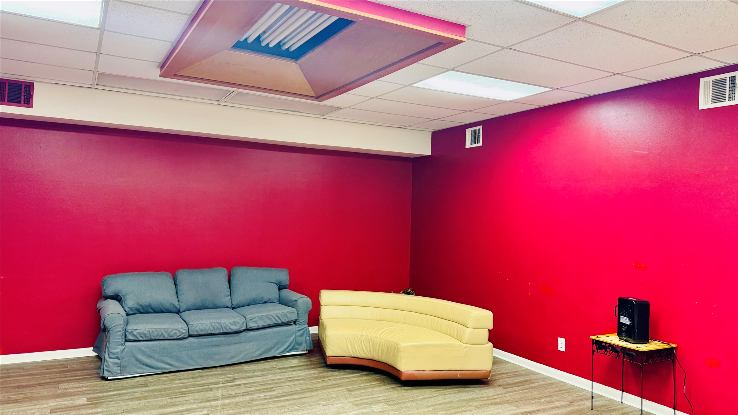 811 North Travis Street Liberty, TX 77575 - Photo 3 of 31 a room with furniture and wooden floor