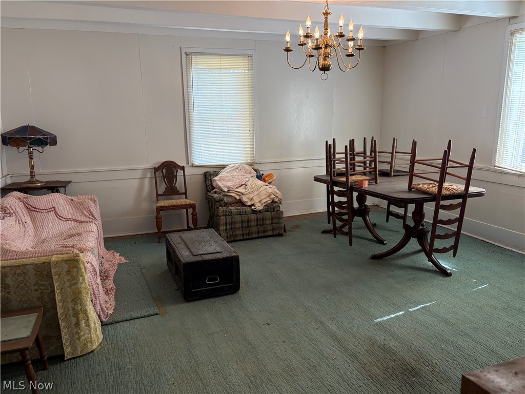 0 Tract 8 Barber Ridge Road Lewisville, OH 43754 - Photo 21 of 49 Carpeted dining space featuring hanging lights and a decorative wall