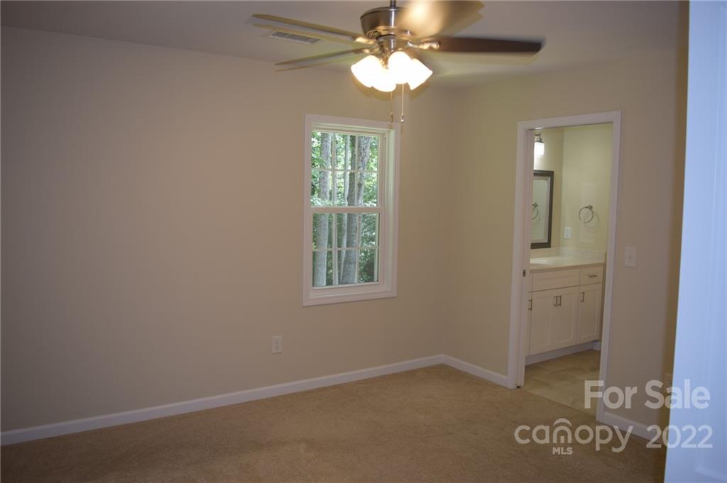 162 Gold Run Rutherfordton, NC 28139 - Photo 12 of 26 an empty room with windows and fan