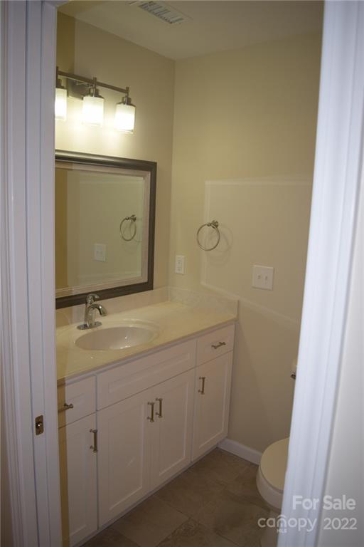 162 Gold Run Rutherfordton, NC 28139 - Photo 14 of 26 a bathroom with a toilet sink and mirror
