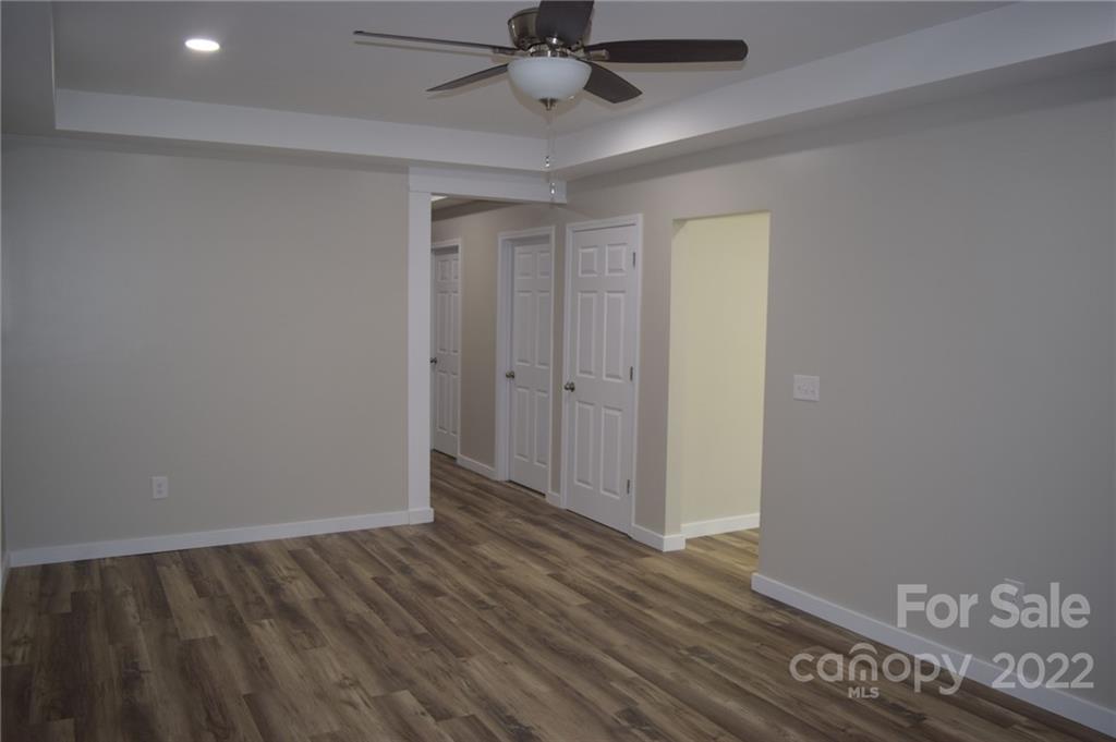 162 Gold Run Rutherfordton, NC 28139 - Photo 18 of 26 wooden floor in an empty room with a window