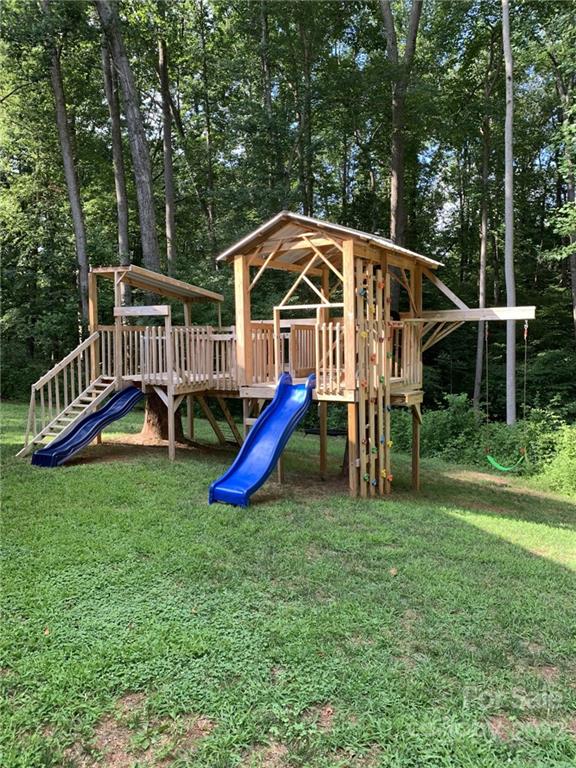 162 Gold Run Rutherfordton, NC 28139 - Photo 24 of 26 a view of a house with a yard deck and a slide