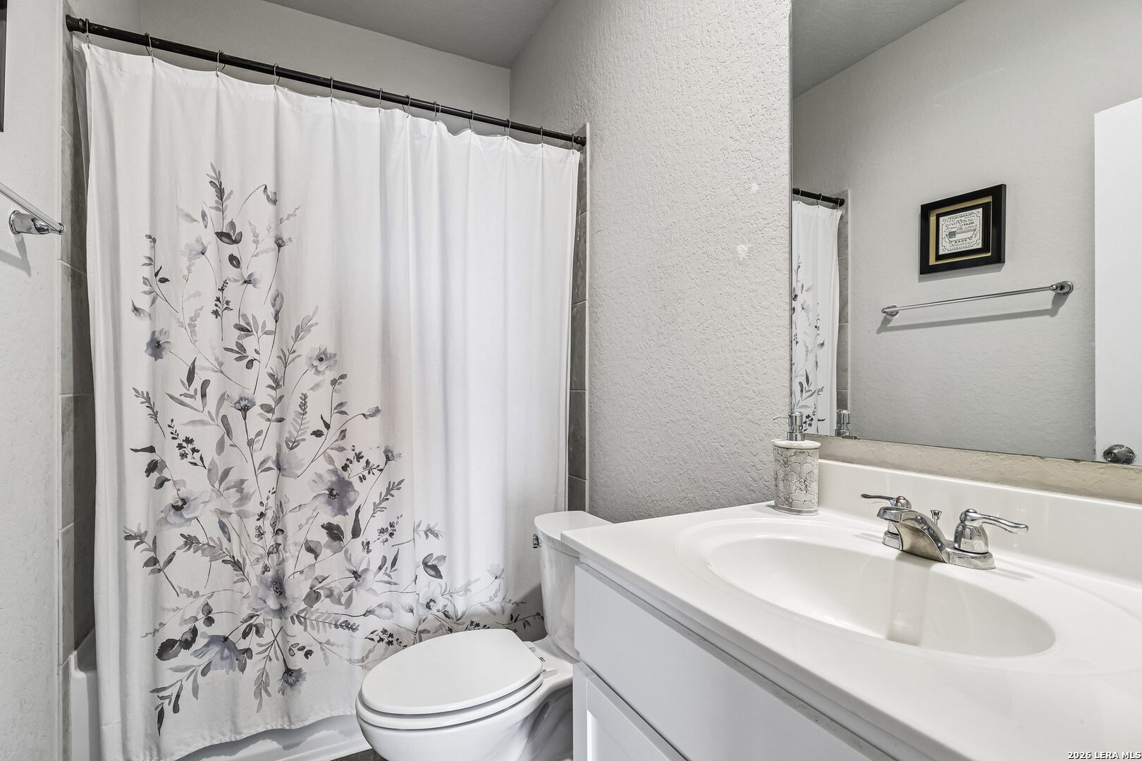 20045 Huckleberry Street Lytle, TX 78052 - Photo 22 of 39 a bathroom with a sink toilet and shower