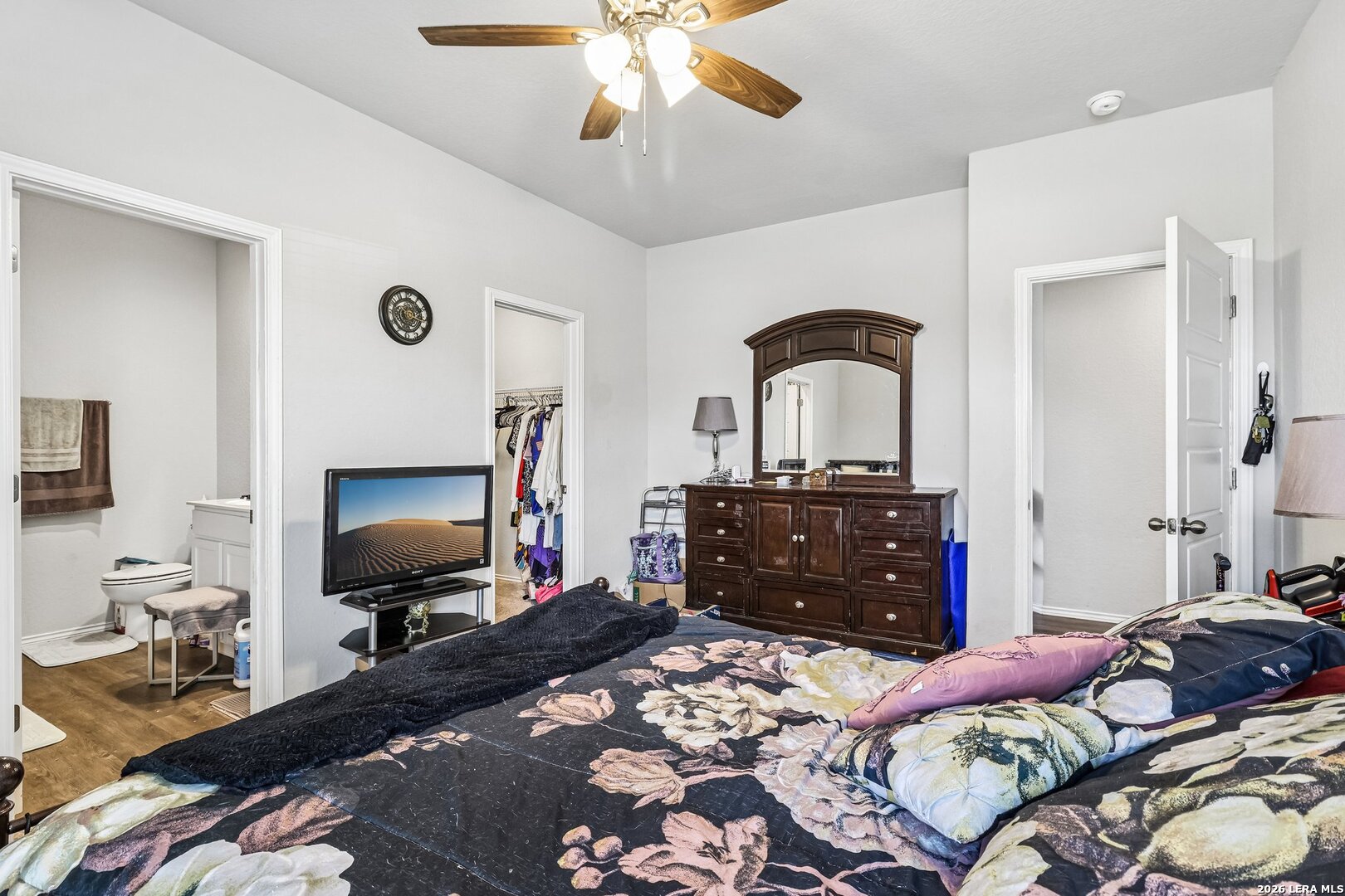 20045 Huckleberry Street Lytle, TX 78052 - Photo 26 of 39 a bedroom with a bed and a flat screen tv