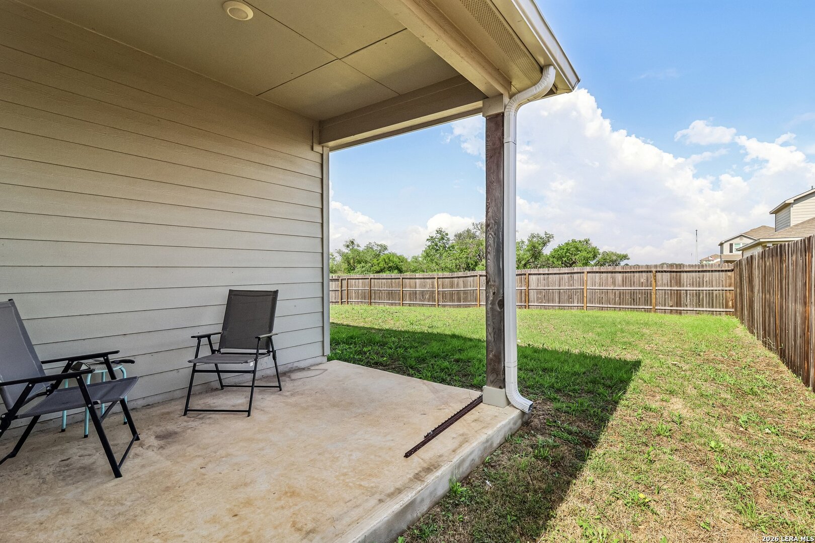 20045 Huckleberry Street Lytle, TX 78052 - Photo 31 of 39 a view of a backyard with chair and table