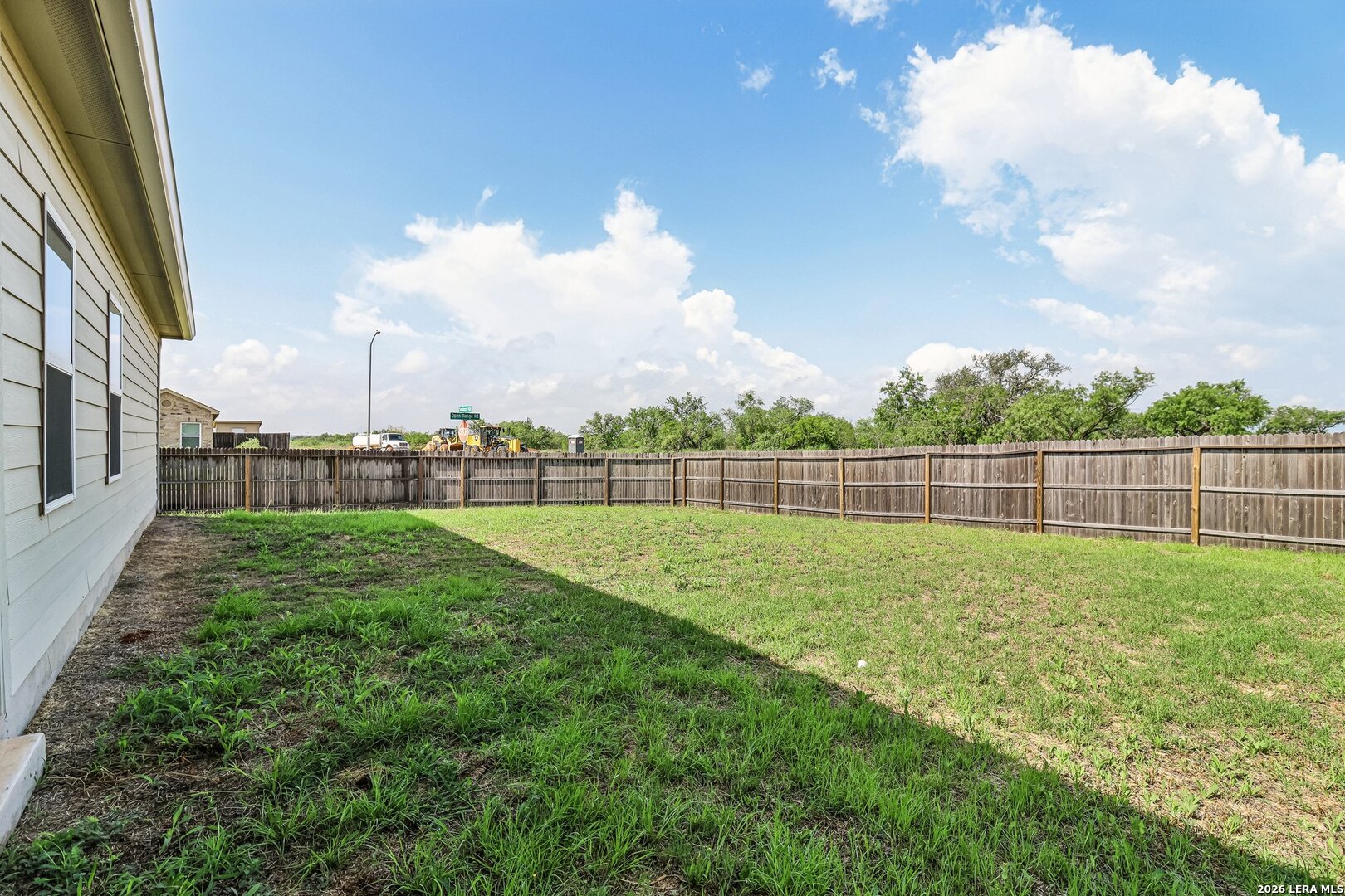 20045 Huckleberry Street Lytle, TX 78052 - Photo 32 of 39 a view of a garden with a slide