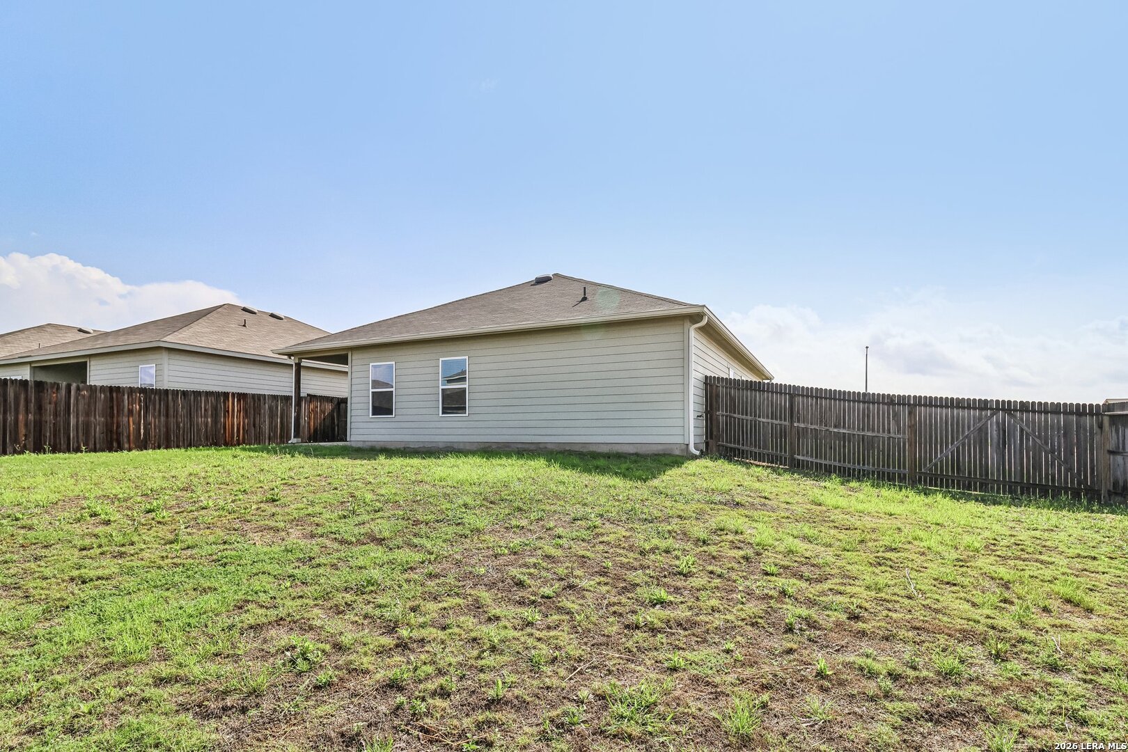 20045 Huckleberry Street Lytle, TX 78052 - Photo 38 of 39 a house view with a backyard space