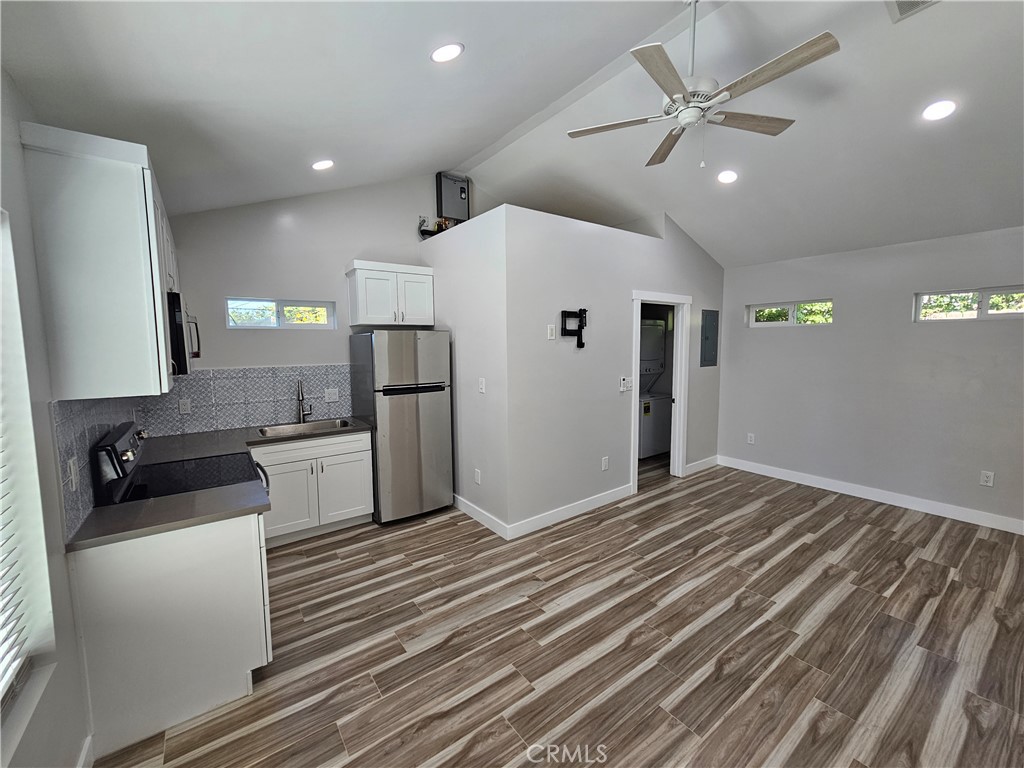 6570 Mt Diablo Avenue Riverside, CA 92506 - Photo 2 of 15 a large white kitchen with a refrigerator and a stove