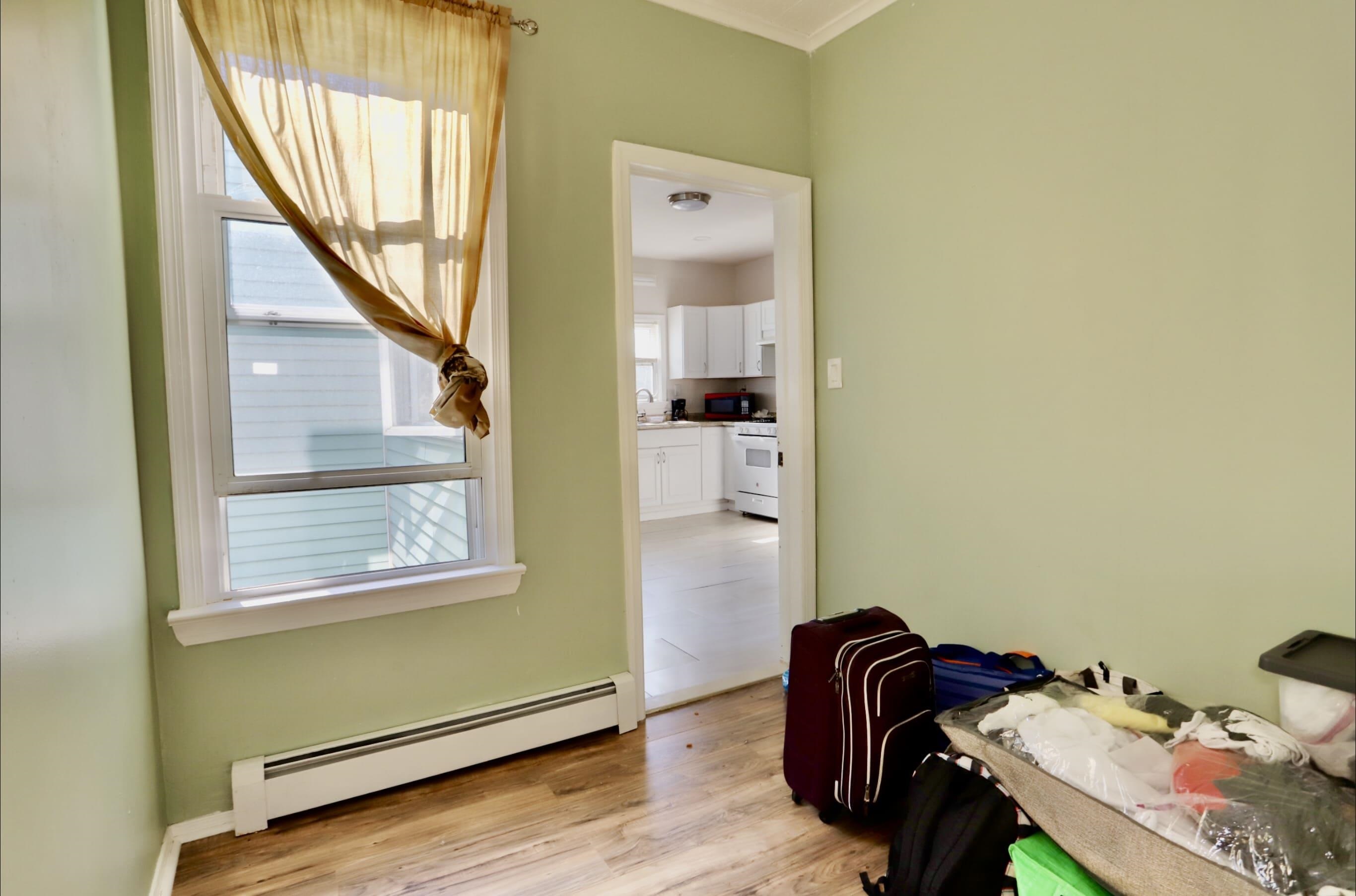 17 Grant Avenue, Unit 2 Harrison, NJ 07029 - Photo 16 of 17 a view of a hallway with furniture and wooden floor