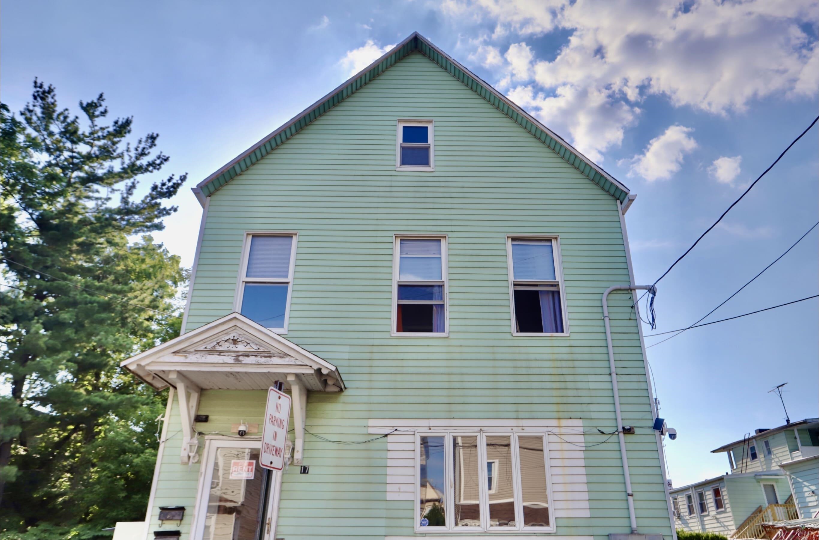 17 Grant Avenue, Unit 2 Harrison, NJ 07029 - Photo 17 of 17 a front view of a house with garden