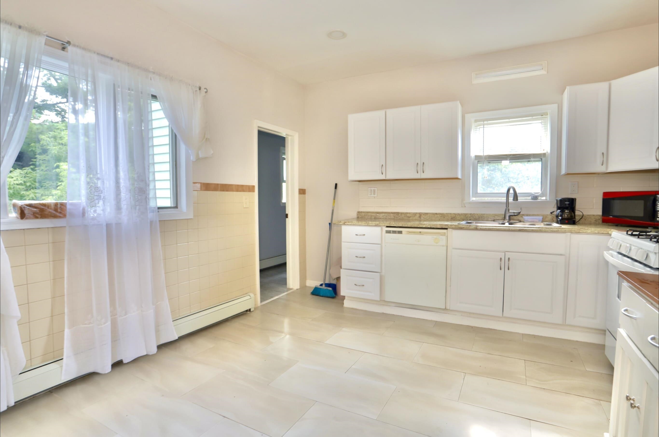 17 Grant Avenue, Unit 2 Harrison, NJ 07029 - Photo 2 of 17 a kitchen with a sink cabinets and window