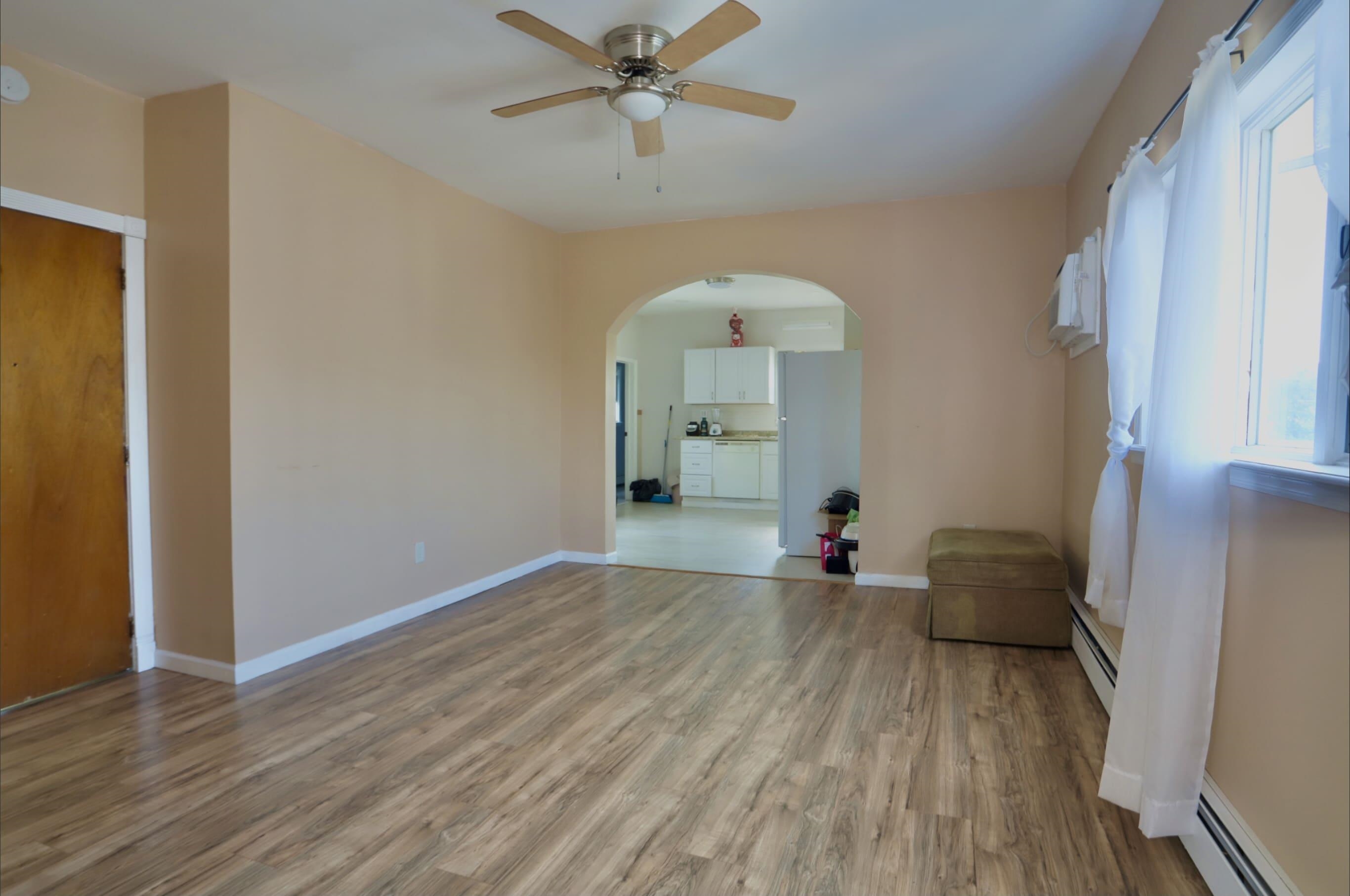 17 Grant Avenue, Unit 2 Harrison, NJ 07029 - Photo 5 of 17 a view of empty room with wooden floor
