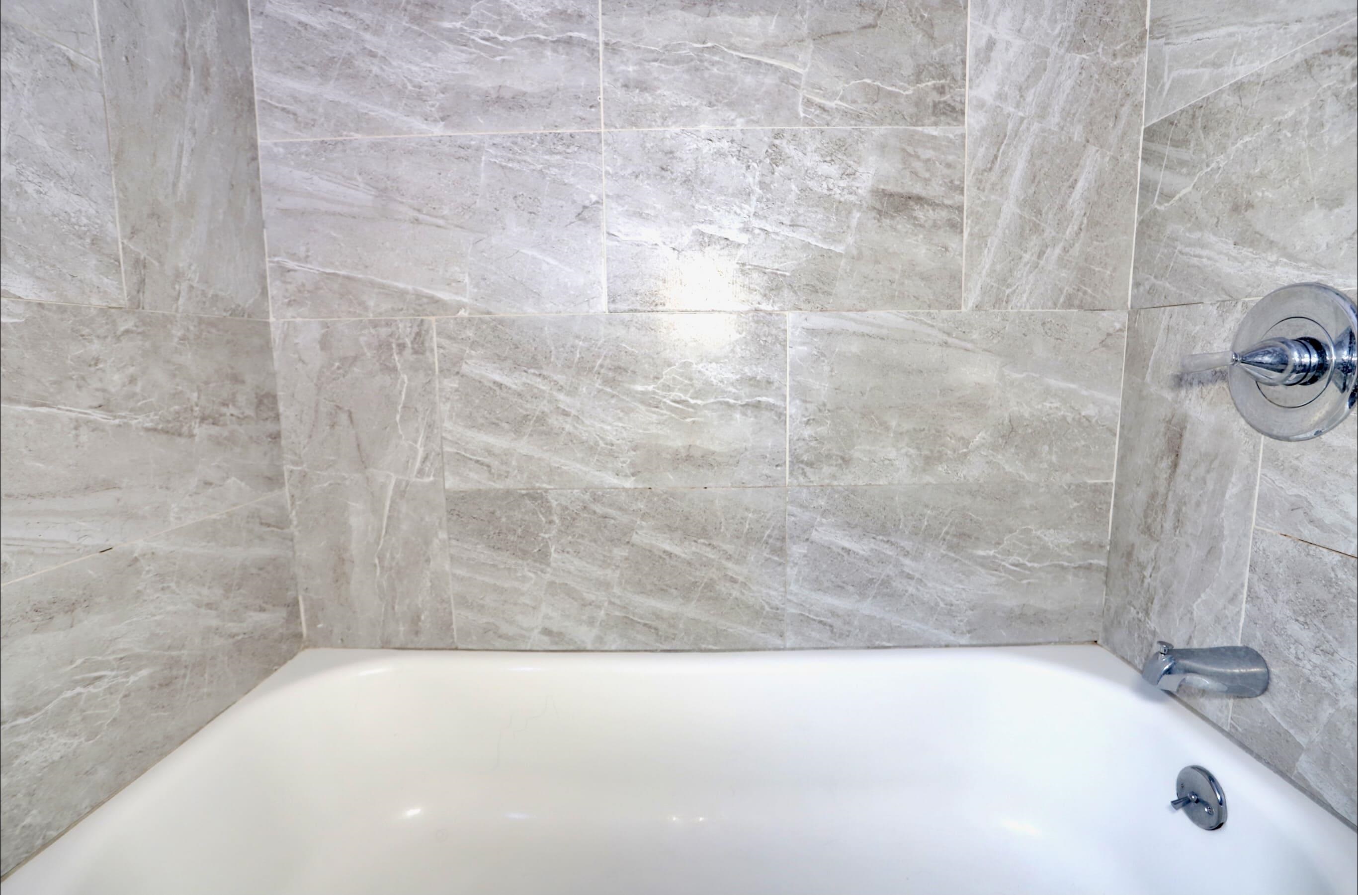 17 Grant Avenue, Unit 2 Harrison, NJ 07029 - Photo 9 of 17 a bathroom with a bathtub