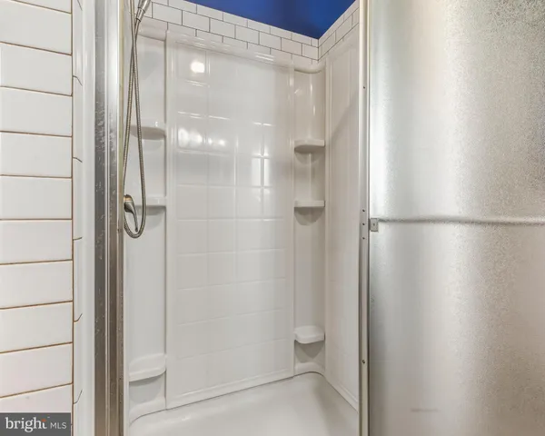 a bathroom with a glass shower door