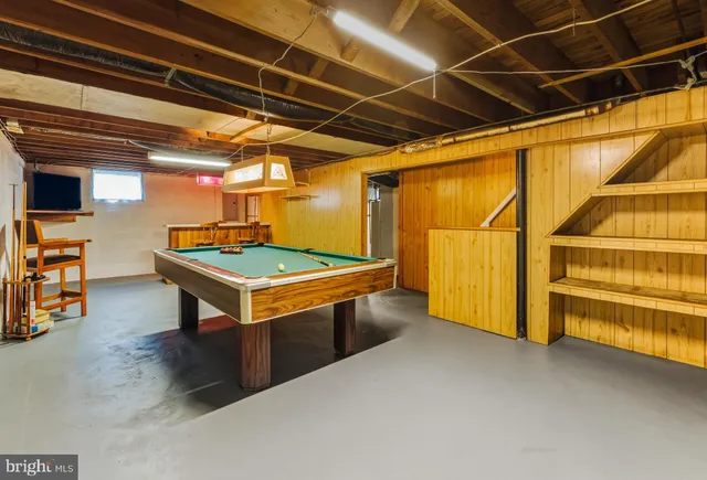 a view of an empty room with gym equipment