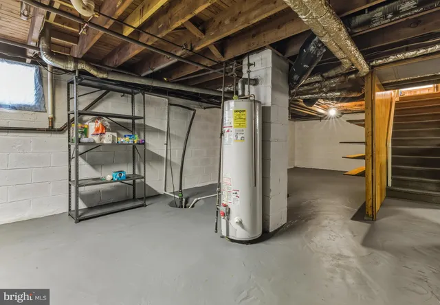 a view of an empty room with a staircase