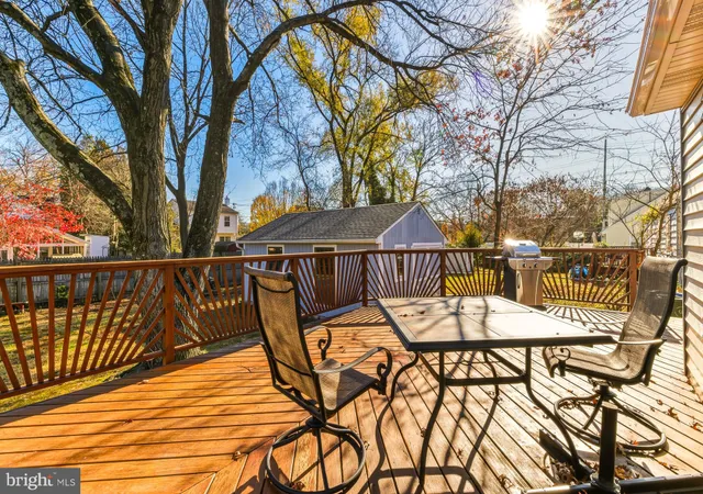 a view of a chairs and table on the deck