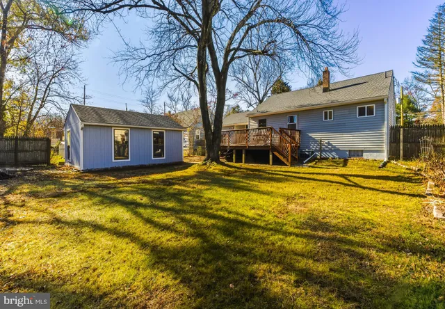 a view of a house with basketball court