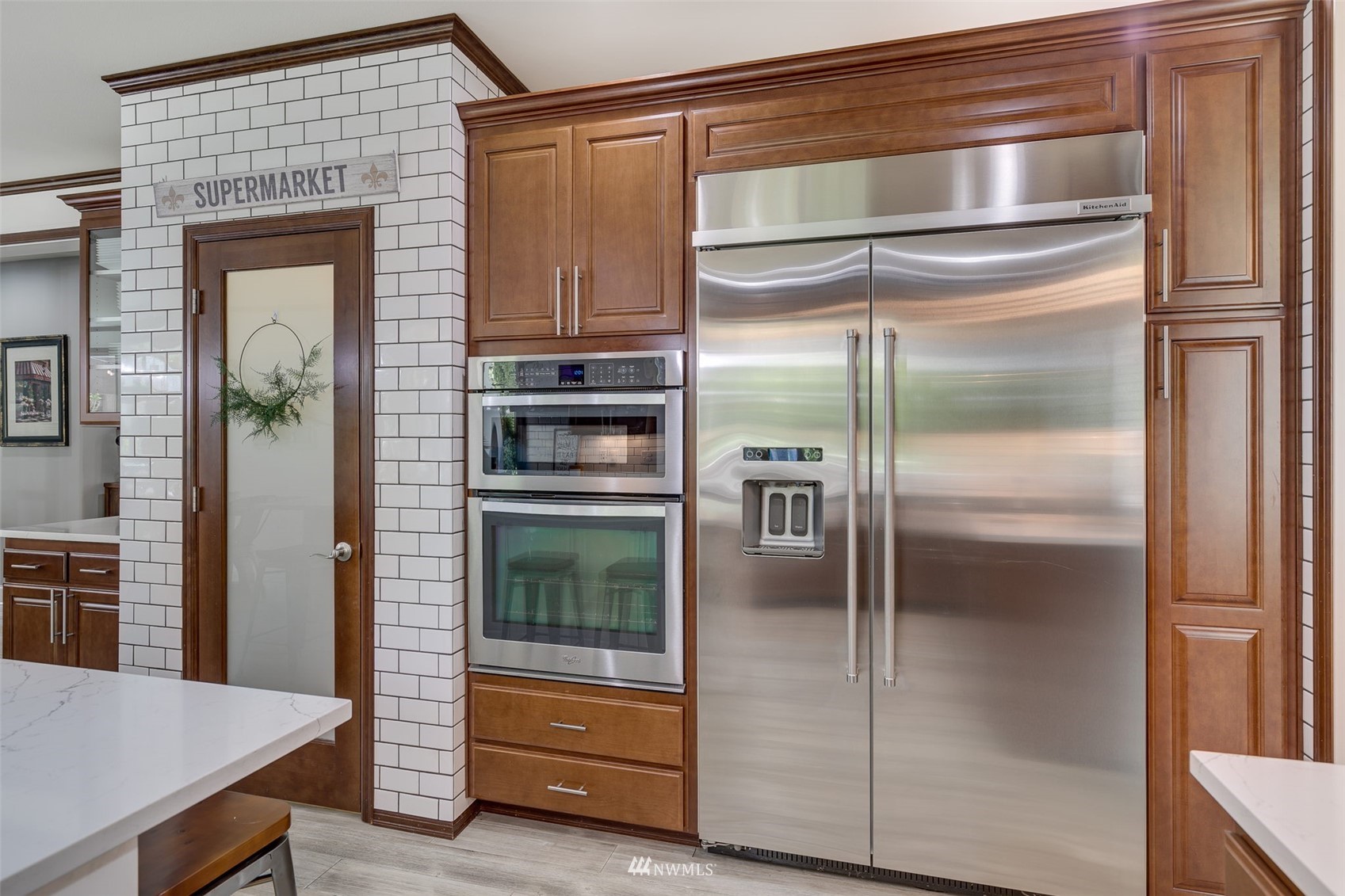 4426 221st Street Southeast Bothell, WA 98021 - Photo 17 of 40 a kitchen with storage and a refrigerator