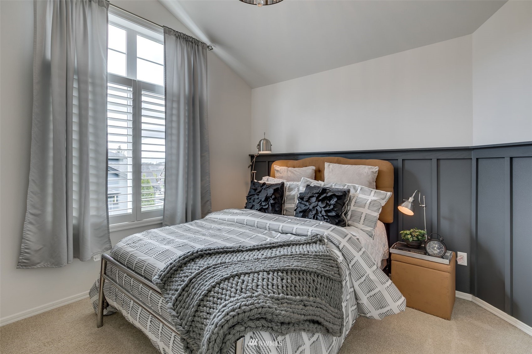 4426 221st Street Southeast Bothell, WA 98021 - Photo 27 of 40 a bed sitting in a bedroom next to a window