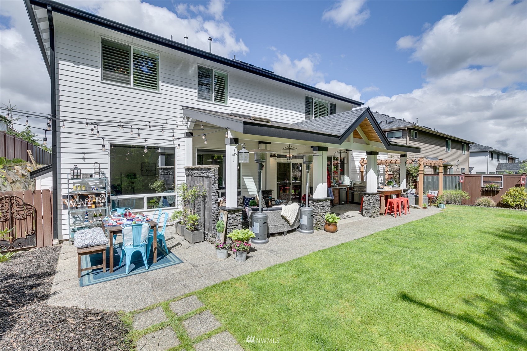 4426 221st Street Southeast Bothell, WA 98021 - Photo 35 of 40 a view of the house with patio and sitting area