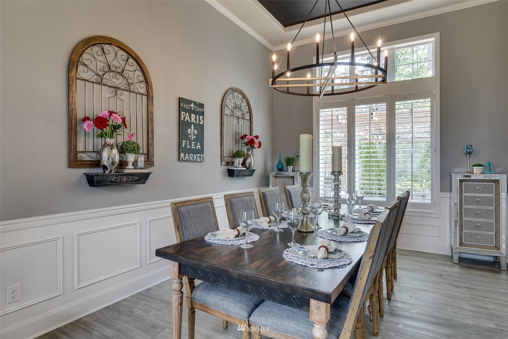 4426 221st Street Southeast Bothell, WA 98021 - Photo 8 of 40 a view of a dining room with furniture chandelier and wooden floor