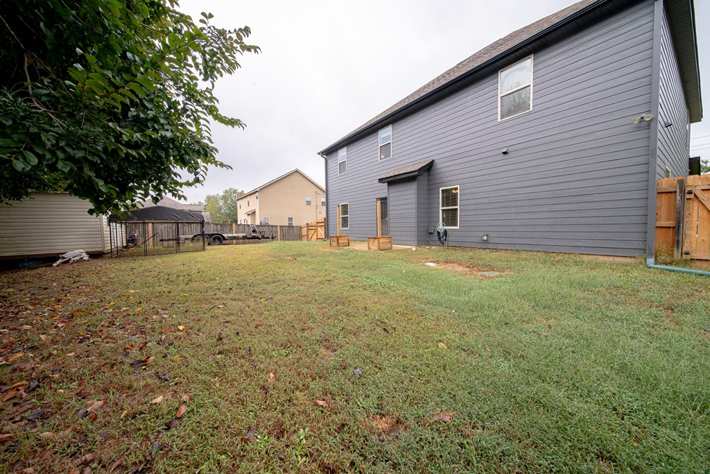 305 Owens Road Fort Mitchell, AL 36856 - Photo 38 of 44 a view of a house with a yard